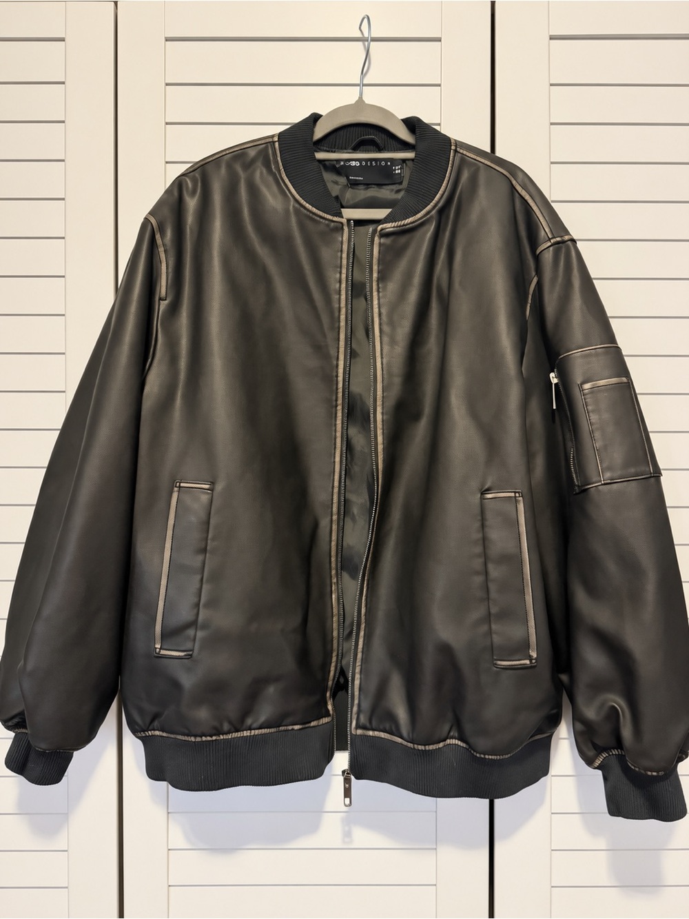 ASOS DESIGN washed faux leather bomber jacket in black